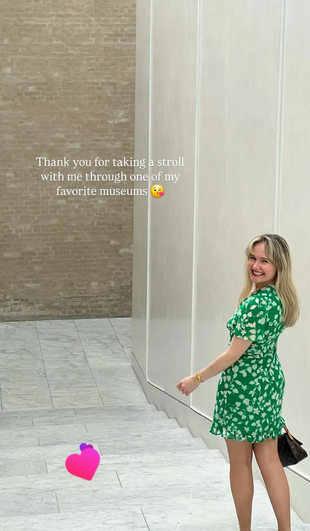 Green dress portrait near museum marble wall