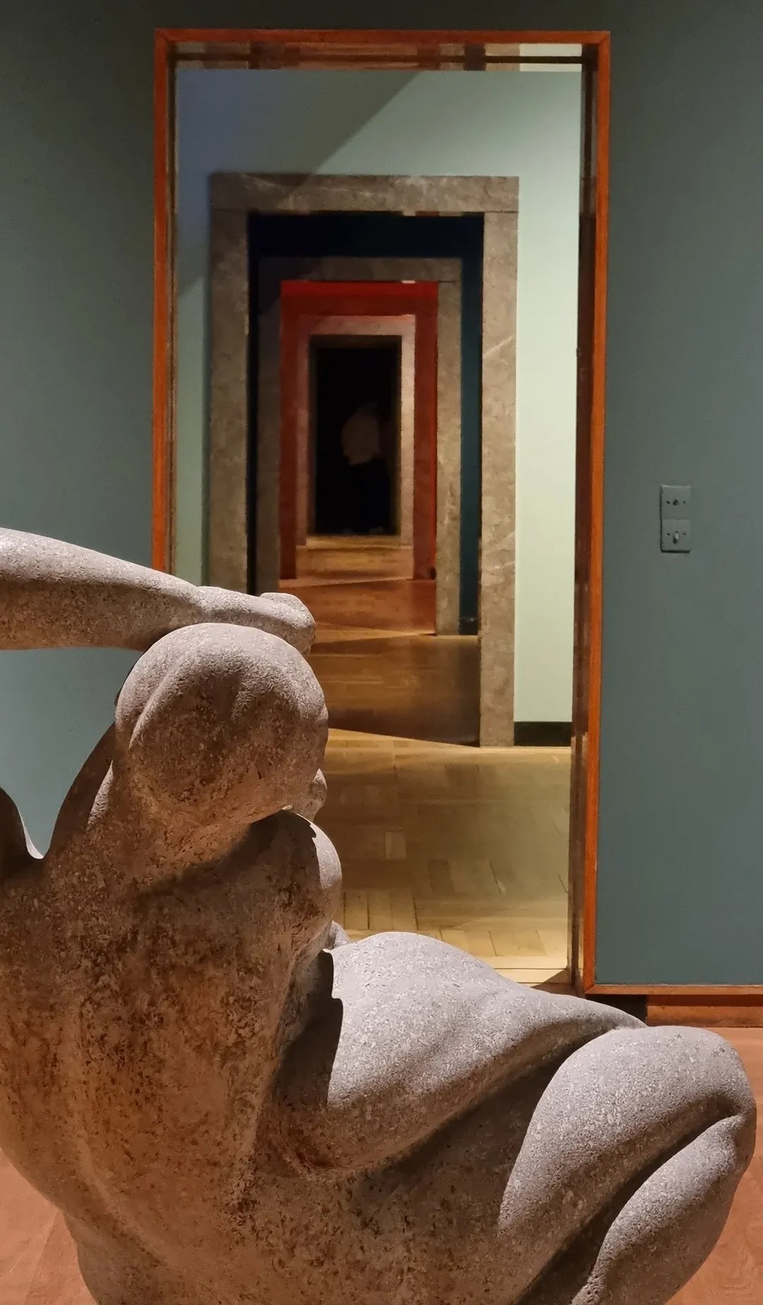 Museum doorway view with sculpture
